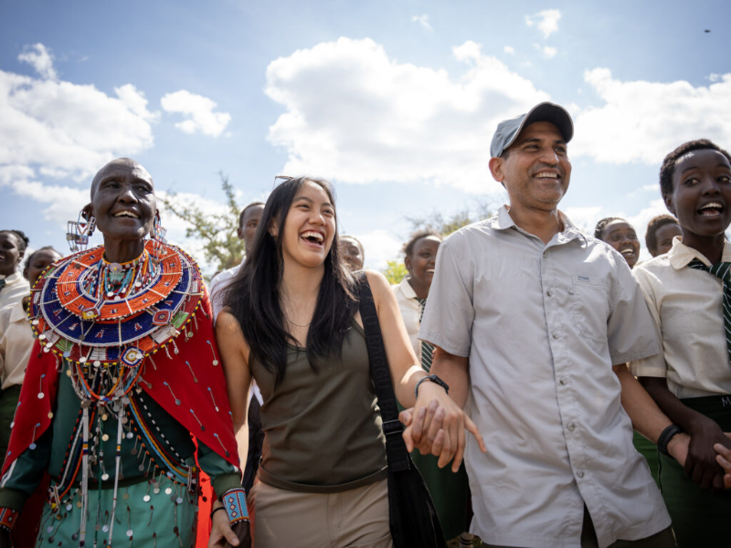 Texas Engineers smiling in a group with Kenya local residents