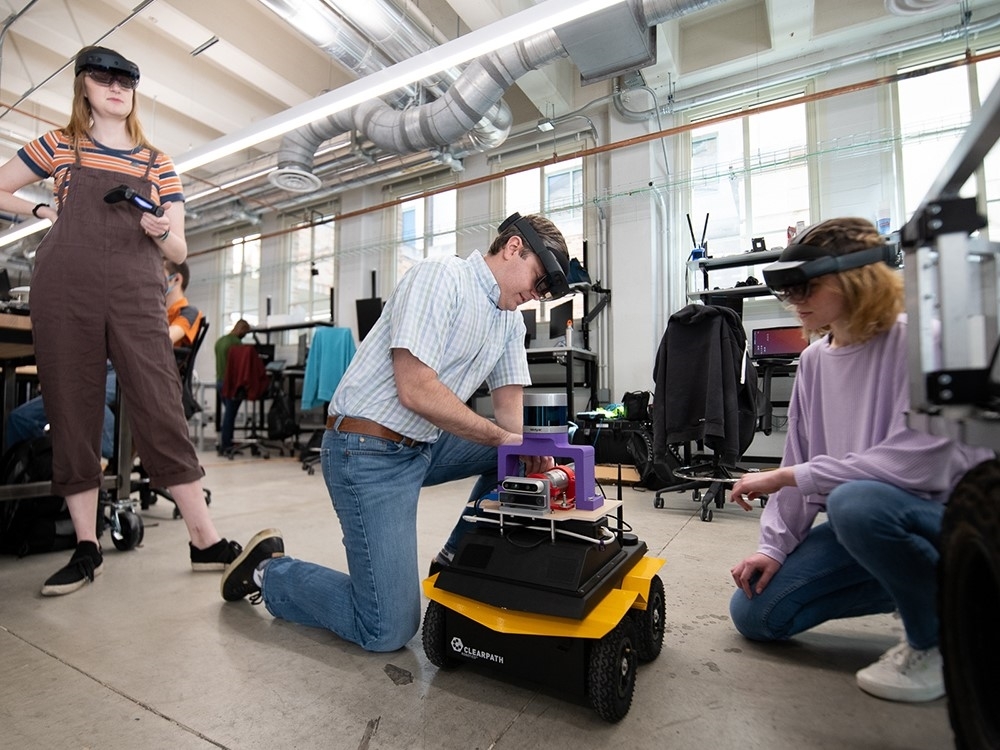 Pike Robotics CEO and Texas Engineering alumnus Connor Crawford works on robots in the Nuclear Applied Robotics Group