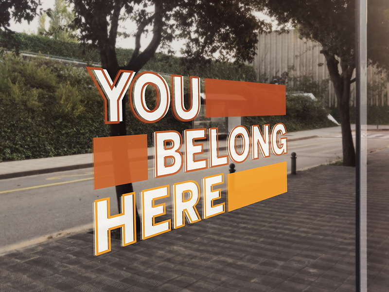 You Belong Here logo on glass facade