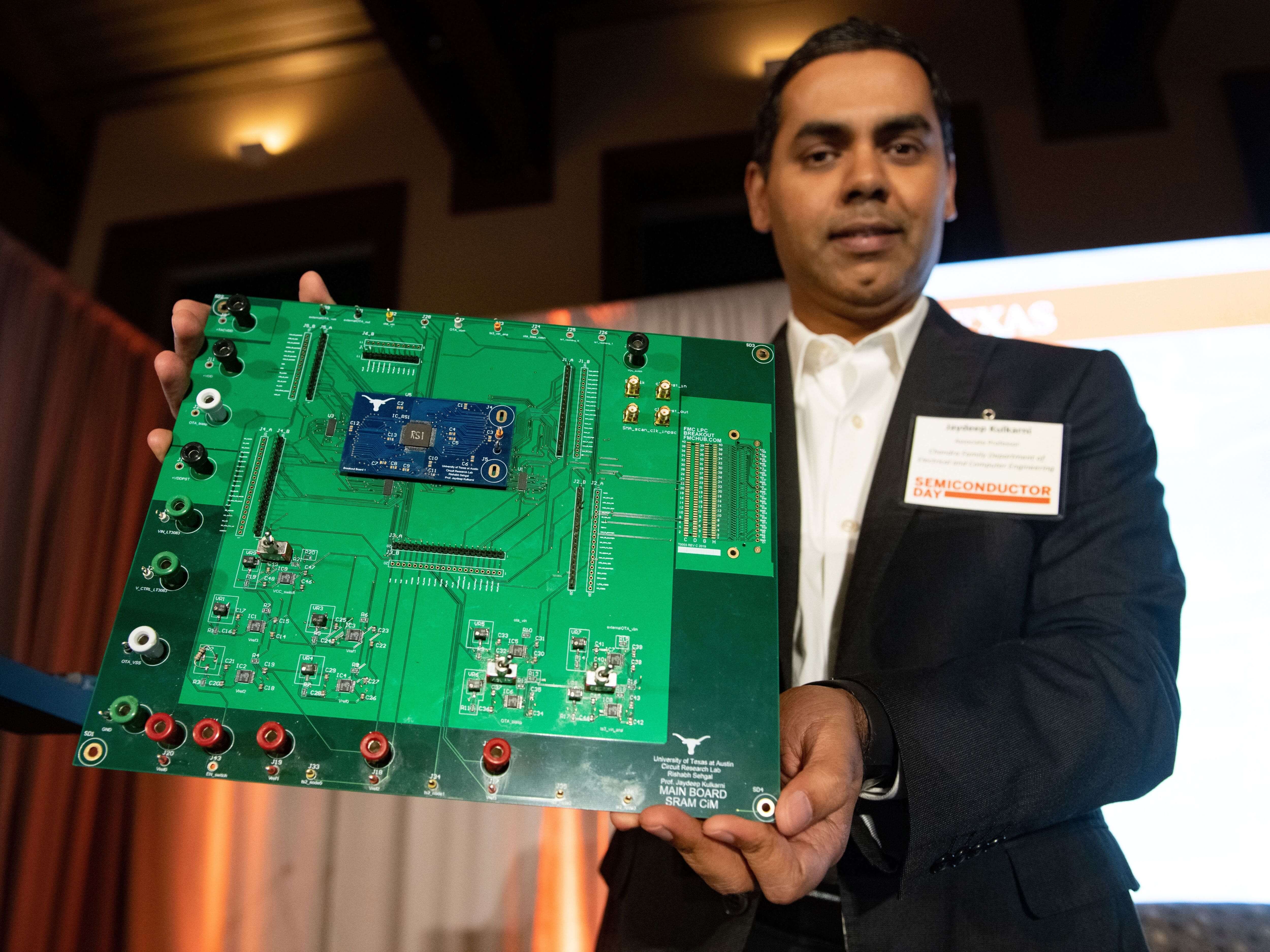 Jaydeep Kulkarni holding semiconductor circuit board