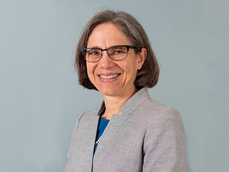 Portrait of Sharon Wood in front of blue background