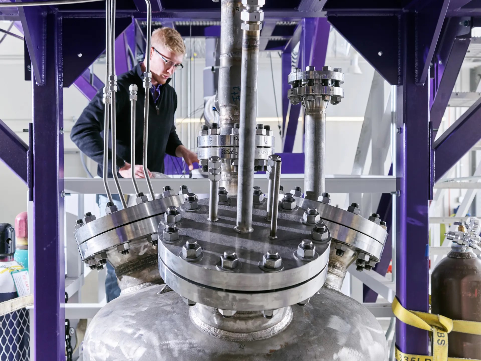 Texas engineer wearing safety gear by nuclear reactor