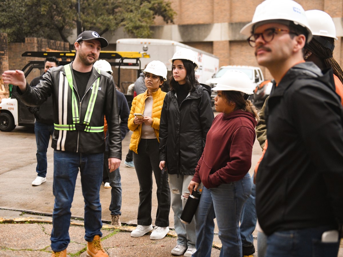 Texas Engineering professor Chris Rausch and his students observe work on the ROKiT unit