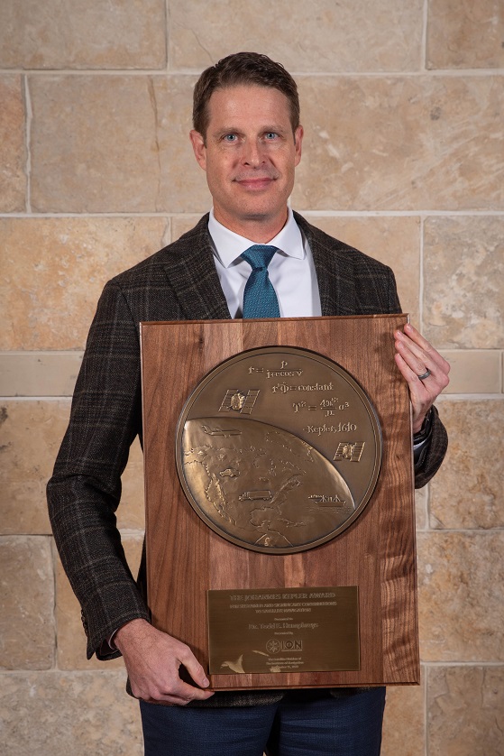 Todd Humphreys holding Johannes Kepler Award