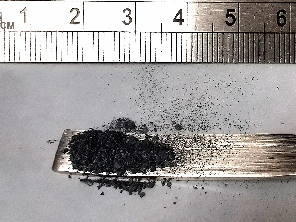 molybdenum disulfide in a spoon