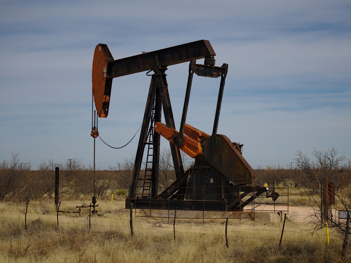 A black and red pump in a West Texas oil field