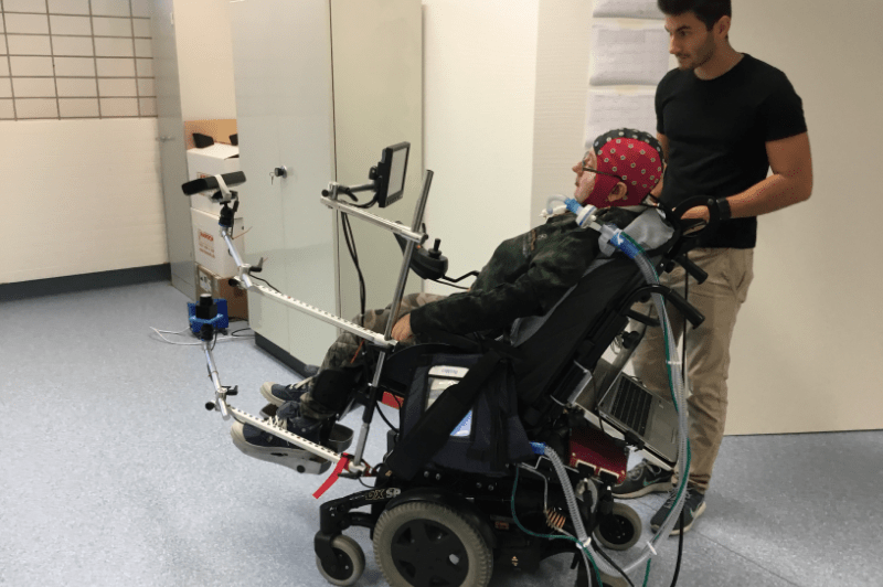 rider in mind-controlled wheelchair with Texas engineering student