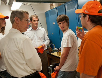 Texas Engineers talking during COTA Solar Car visit