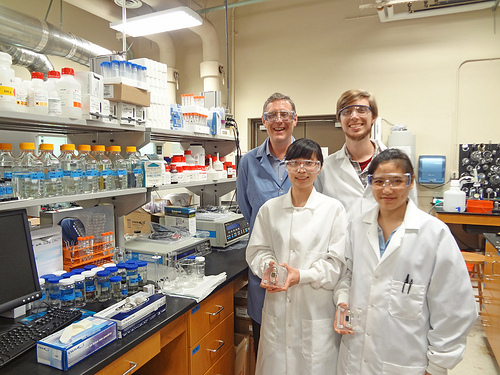 Texas Engineer Benny Freeman smiling in his lab with research team