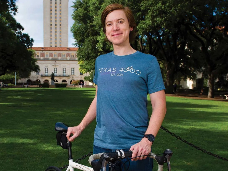 Chris Condit standing outside with a bicycle