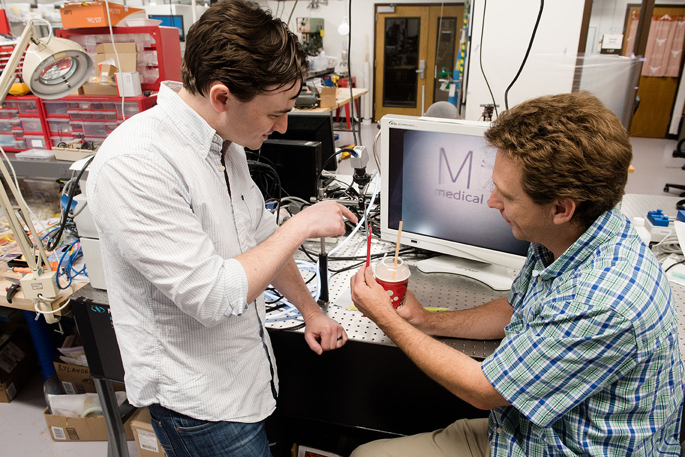 Professor Chris Rylander working on Slurpee straw with TX engineering student