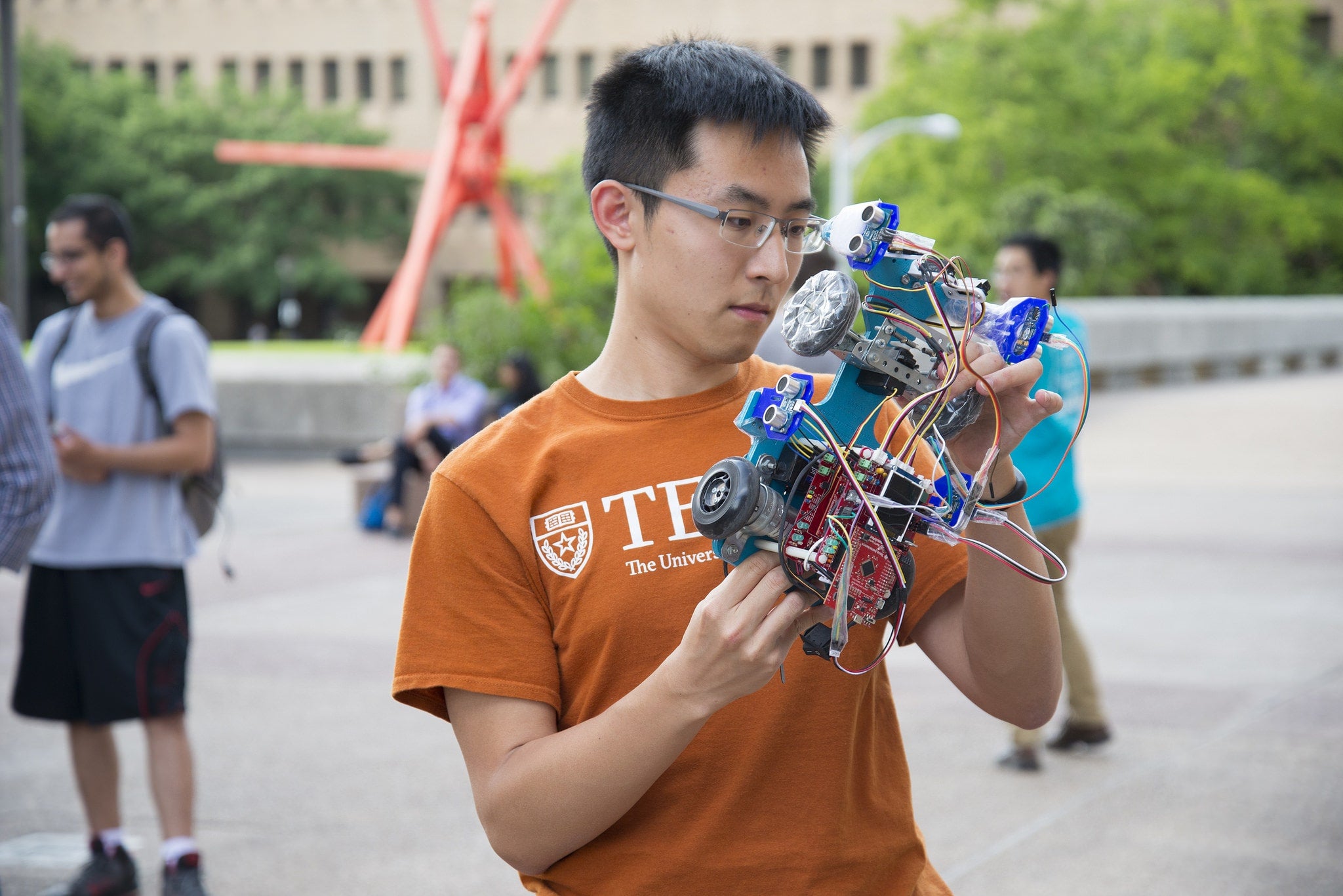 student with robotic car