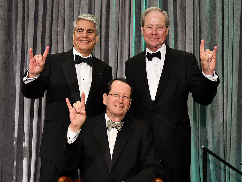 UT Austin President Gregory L. Fenves, UT Engineering alumnus Ernie Cockrell and Welch Foundation President Norbert Dittrich (seated) at a reception on Oct. 21.