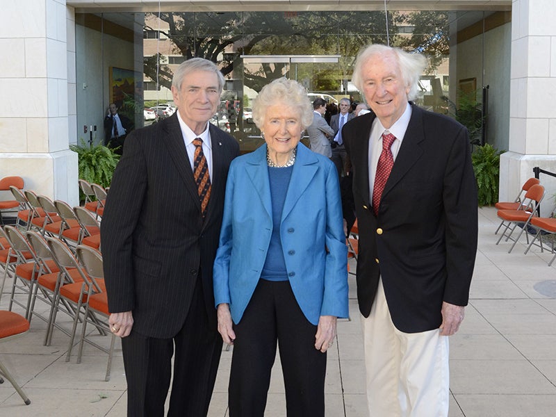 J. Tinsley Oden, Edith and Peter J. O'Donnell, Jr outside the building that bears their name on campus at UT Austin.