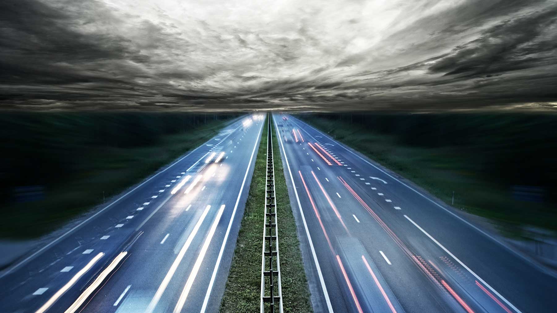 Cars run up and down on highway