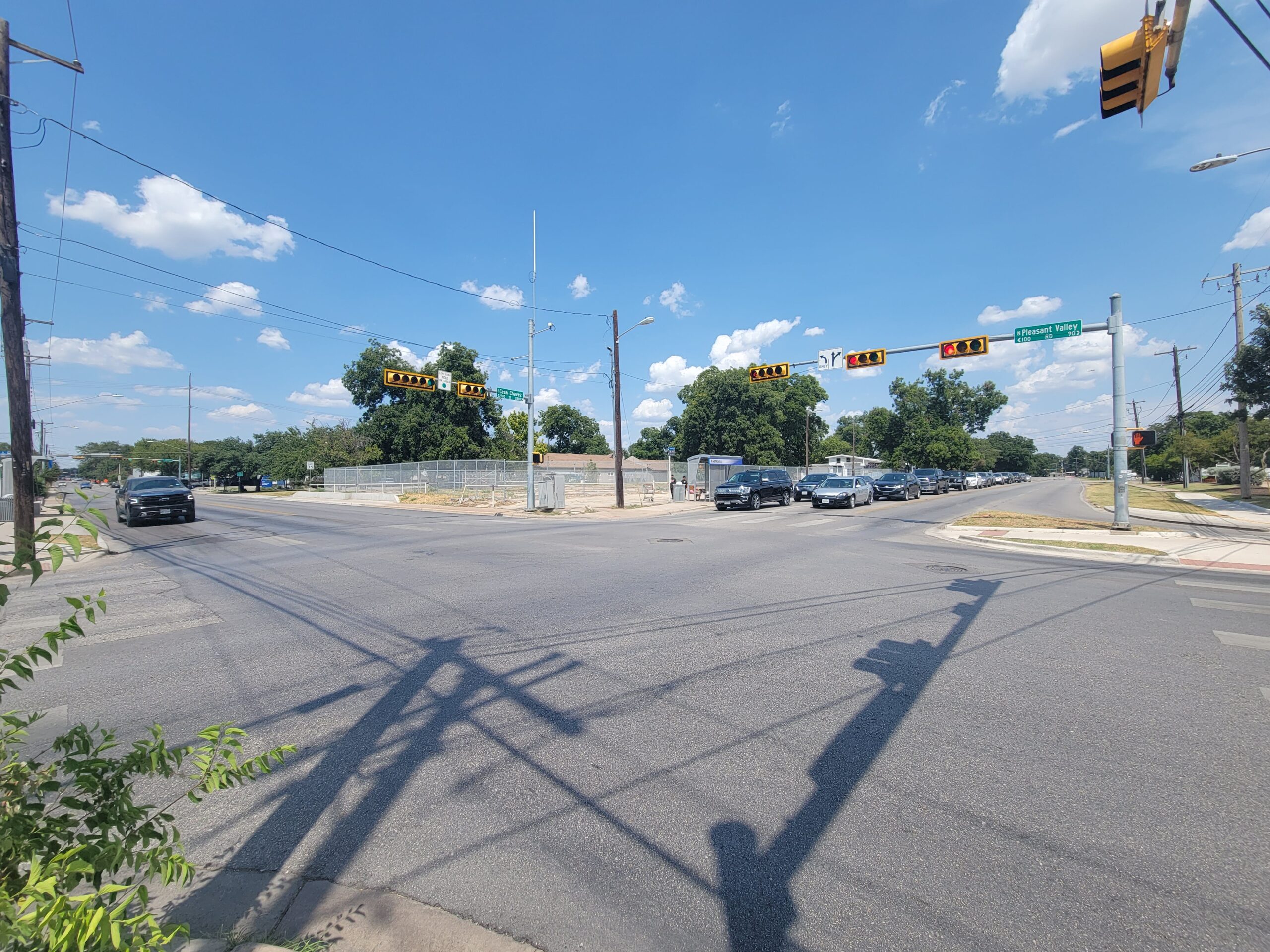 intersection with two groups of cars stopped at stoplights