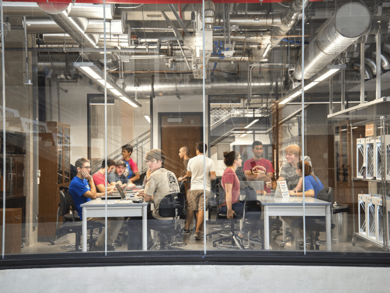 Texas engineering students gathered at a table