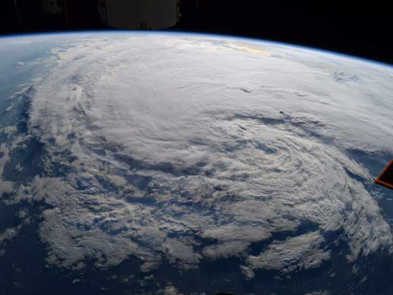 Satellite view of storm gathering over ocean
