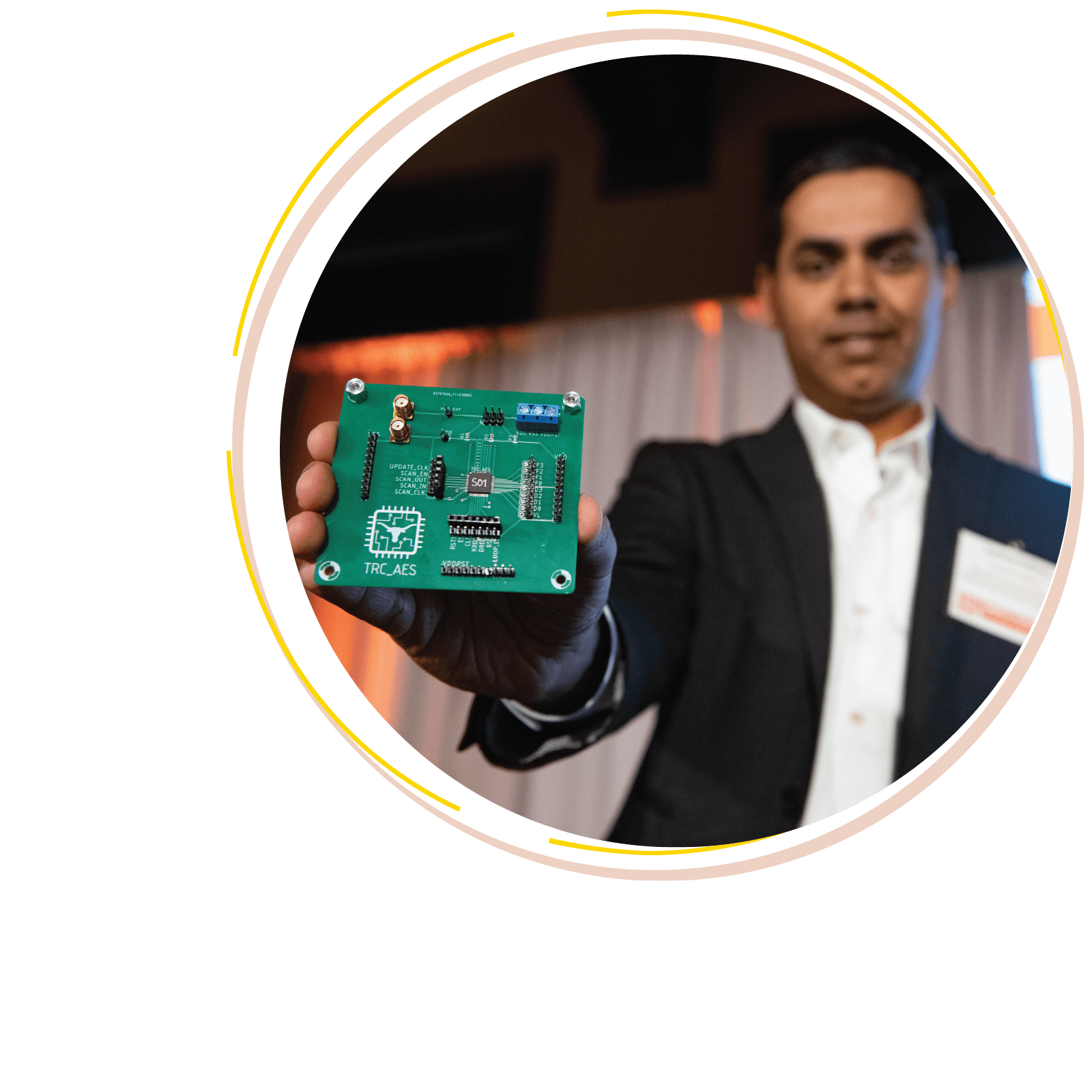 faculty holding UT-fabricated chip