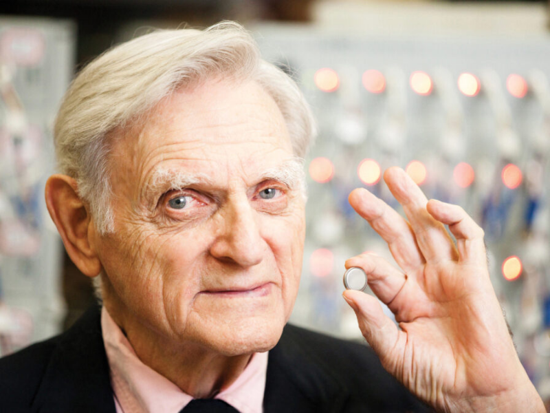 Texas Engineer John Goodenough holding lithium ion battery