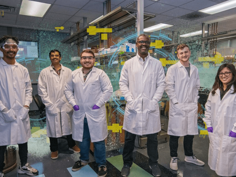 Texas Engineer Tyrone Porter and researchers standing in lab