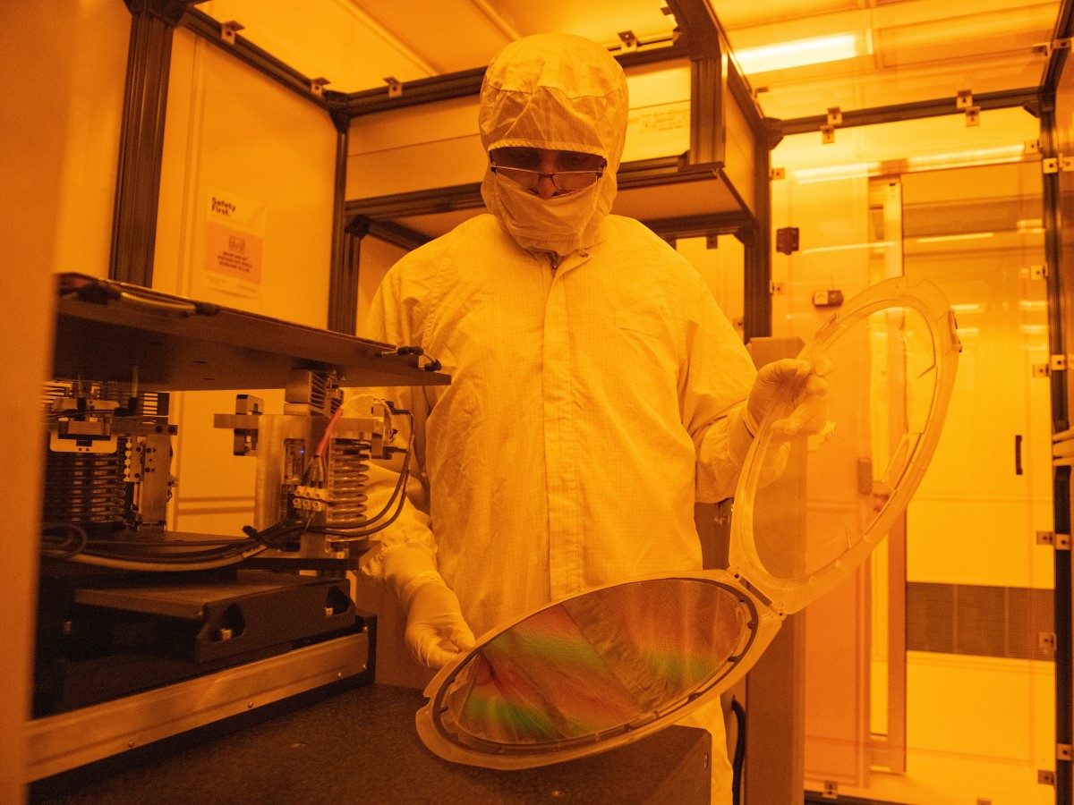 Texas Engineers looking at equipment in a semiconductor lab