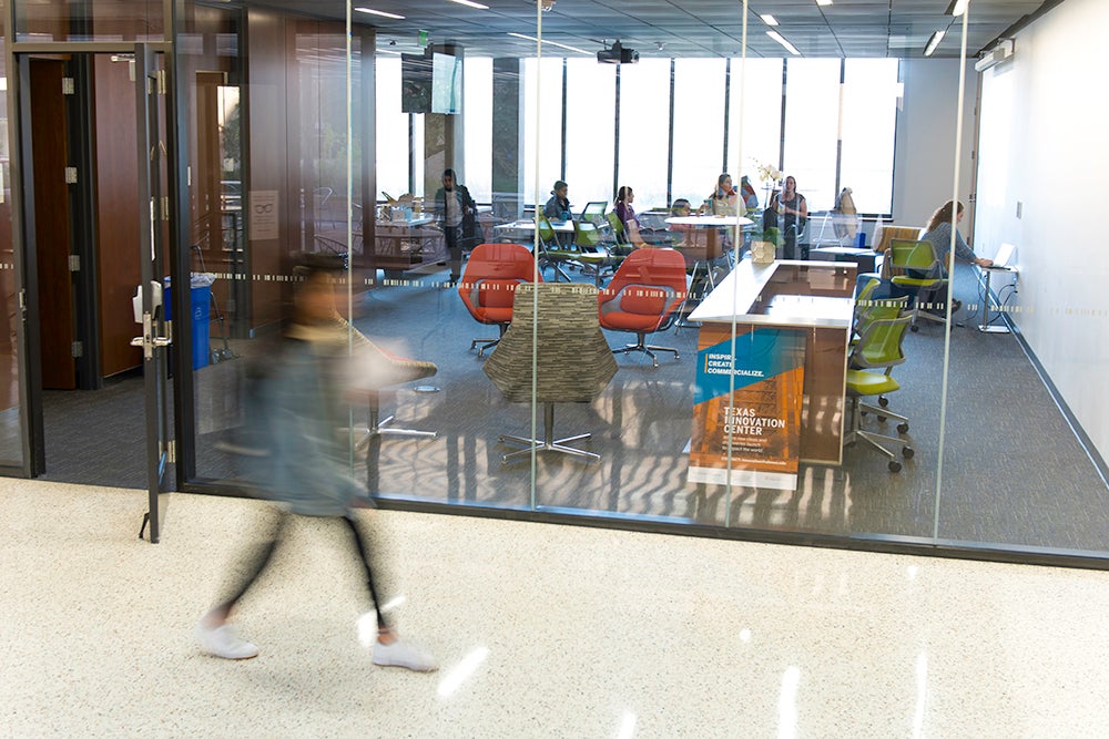 student walks by Texas Innovation Center