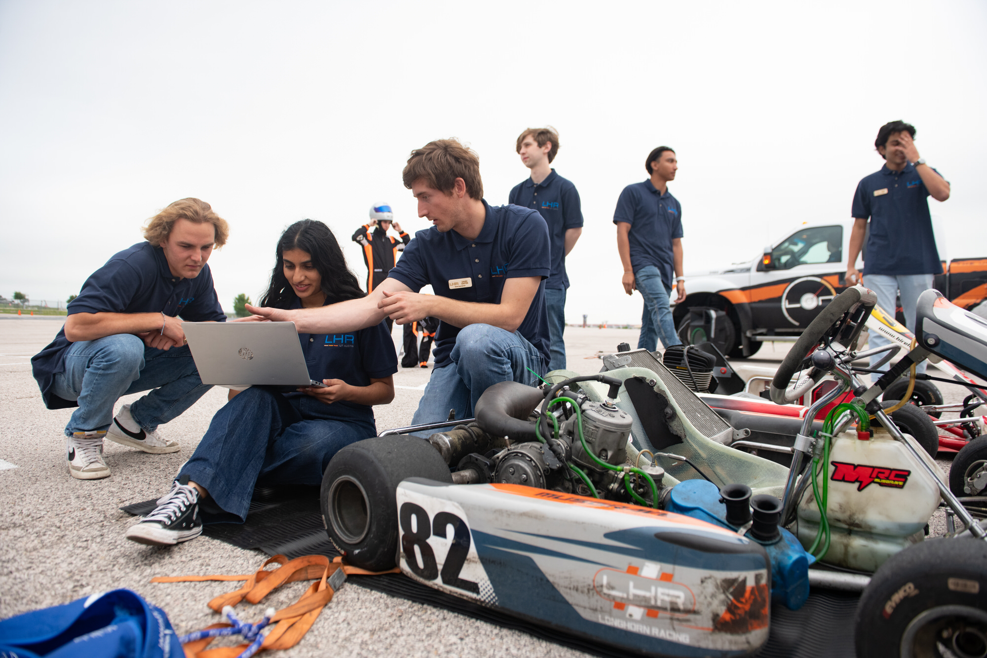 Students working on Longhorn racing car for upcoming competition.