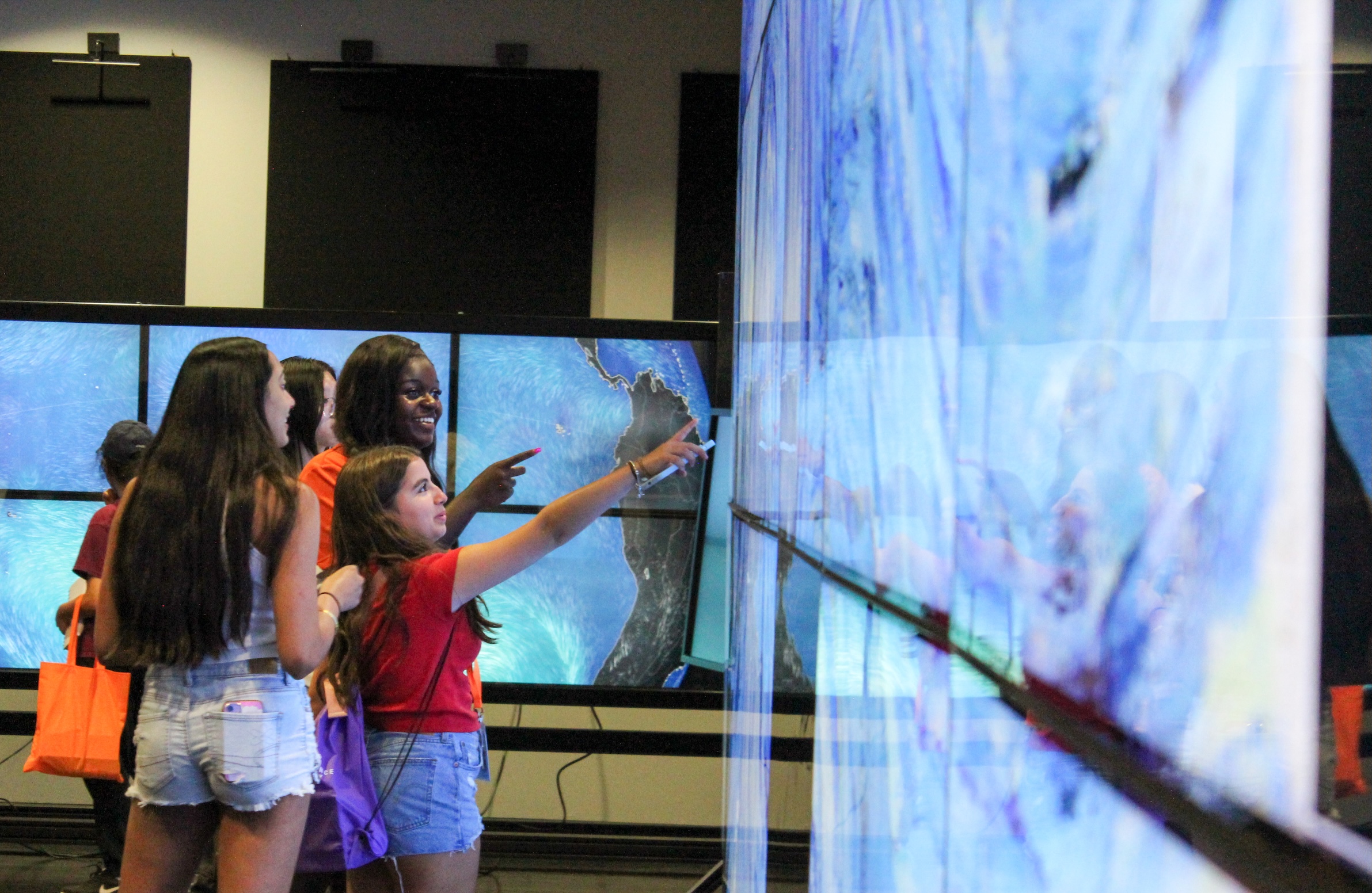 Students in TACC lab learning at the large screens.