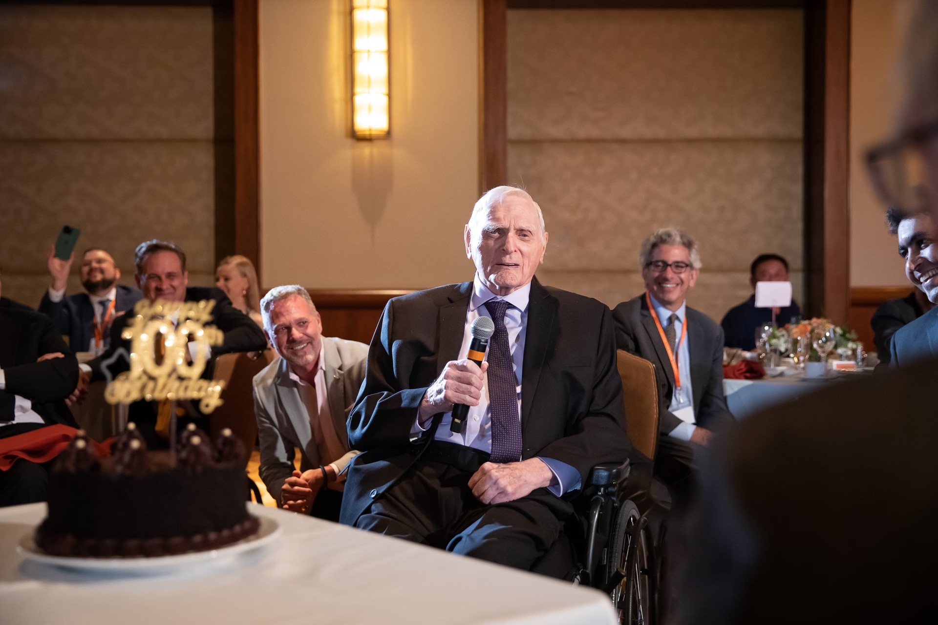 Goodenough speaks at his 100th birthday party.