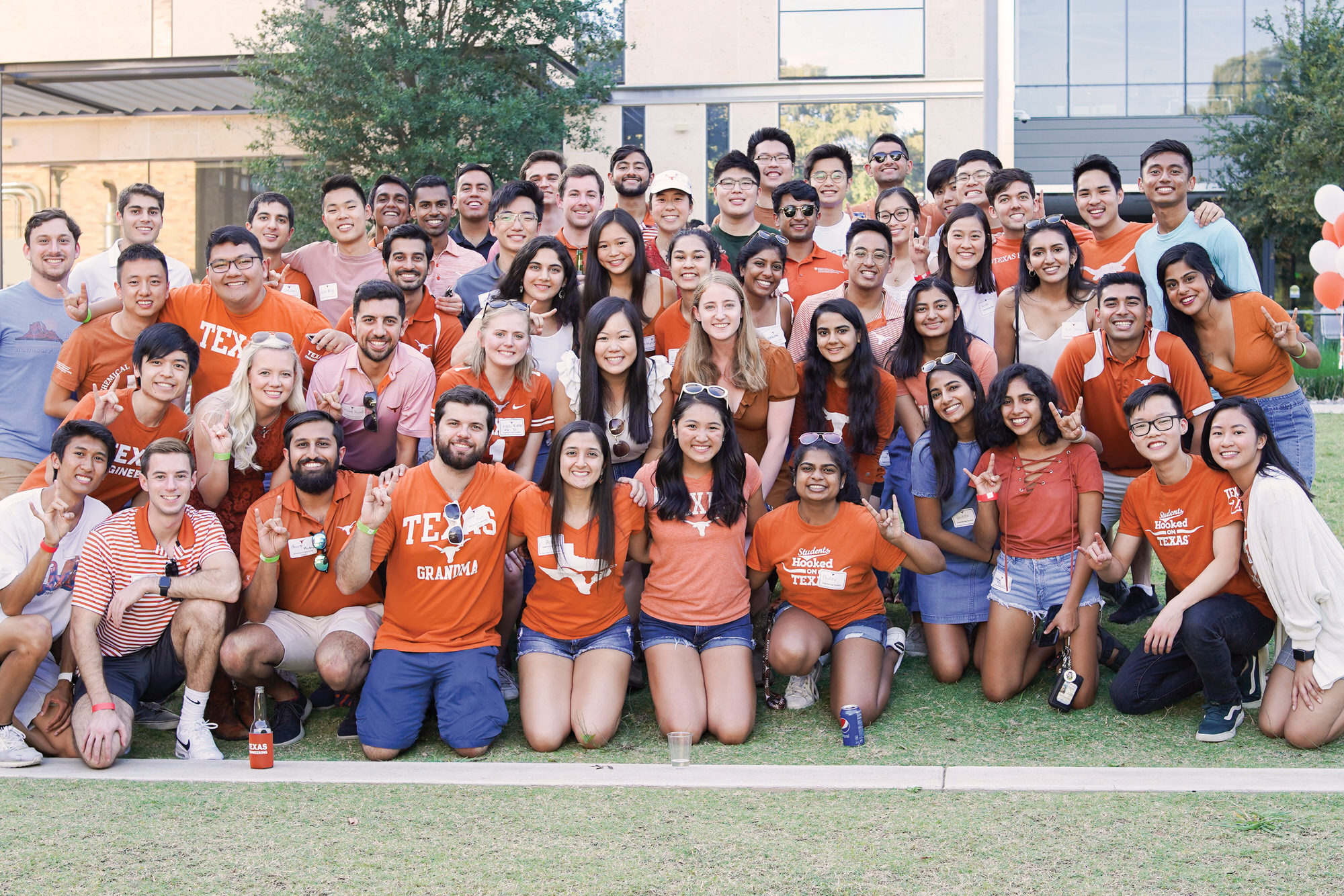 Large group of Texas Engineering students at Cockrell Tailgate outside the EER. 