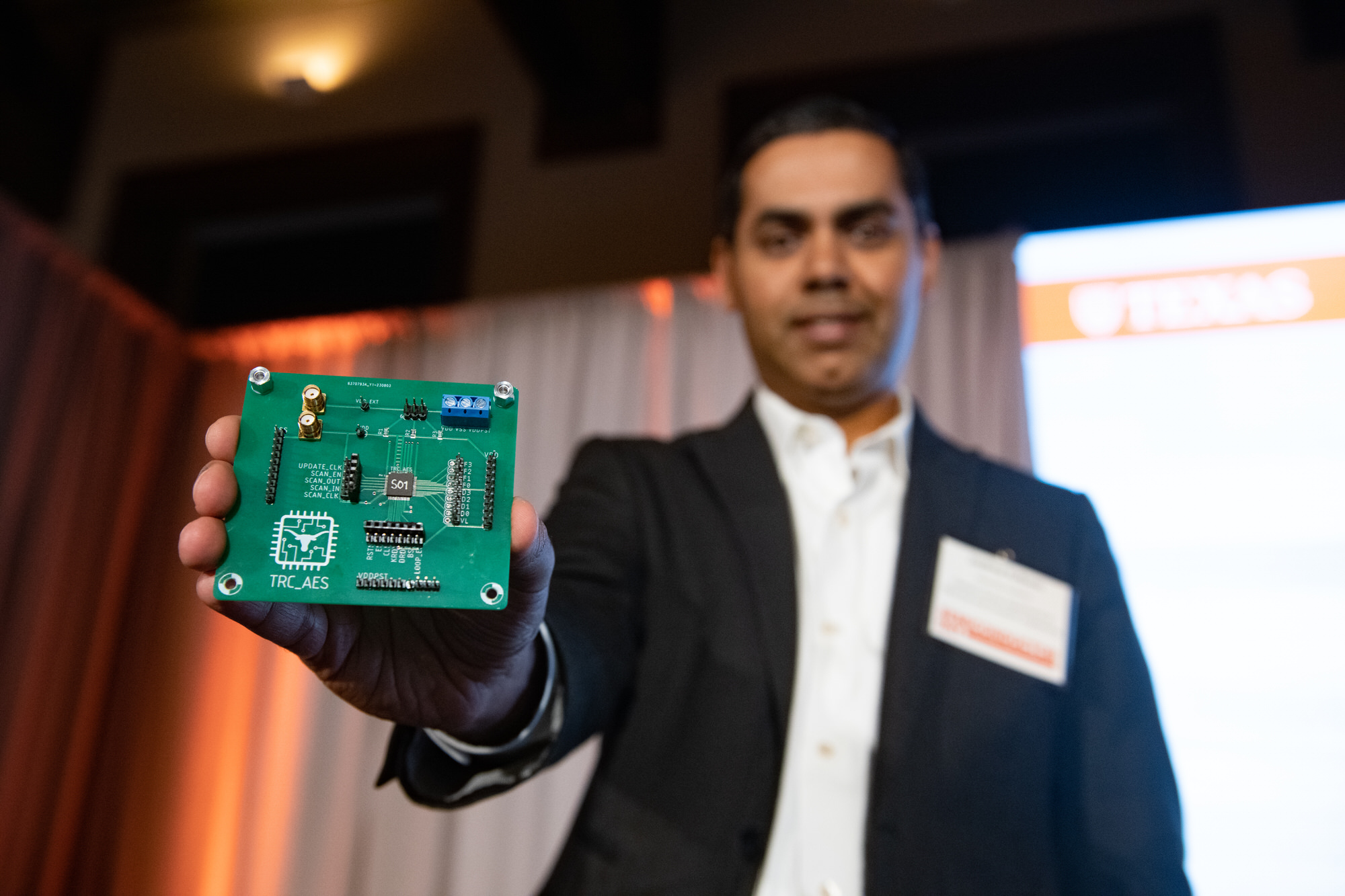 Jaydeep Kulkarni holding semiconductor circuit board
