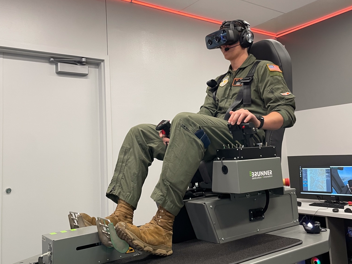 Aerospace engineering student and ROTC pilot Jack Lasater demonstrates the new virtual reality flight simulators.
