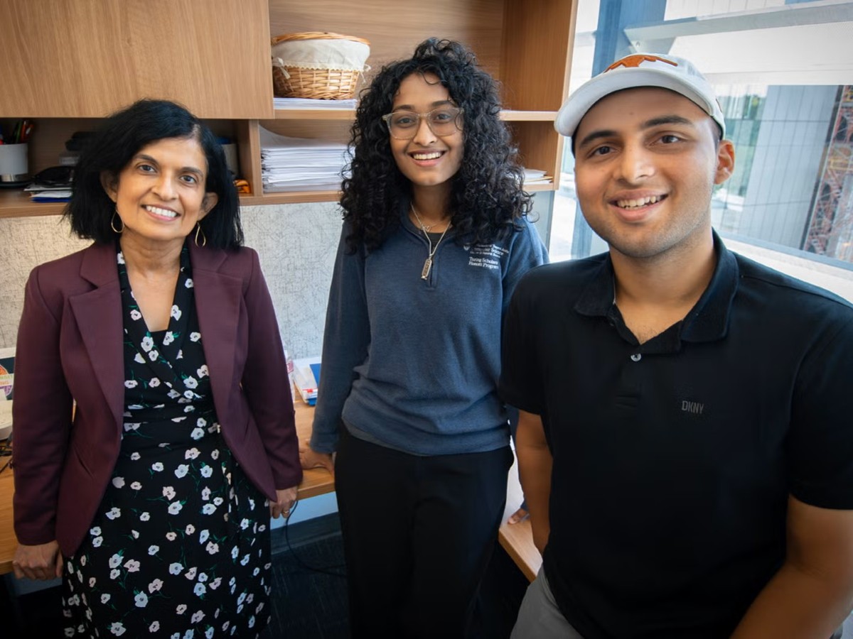 Texas Engineer Nina Telang with students in her office.
