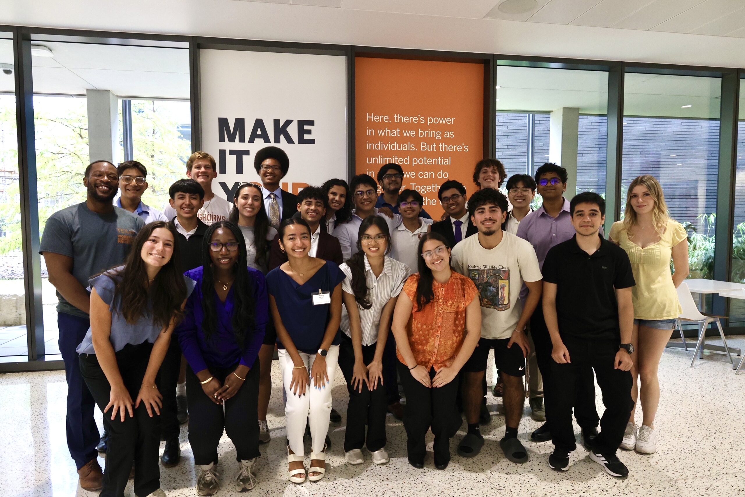 Texas Engineering students and ESSC Executive Director Courtney McElroy smiling in a group