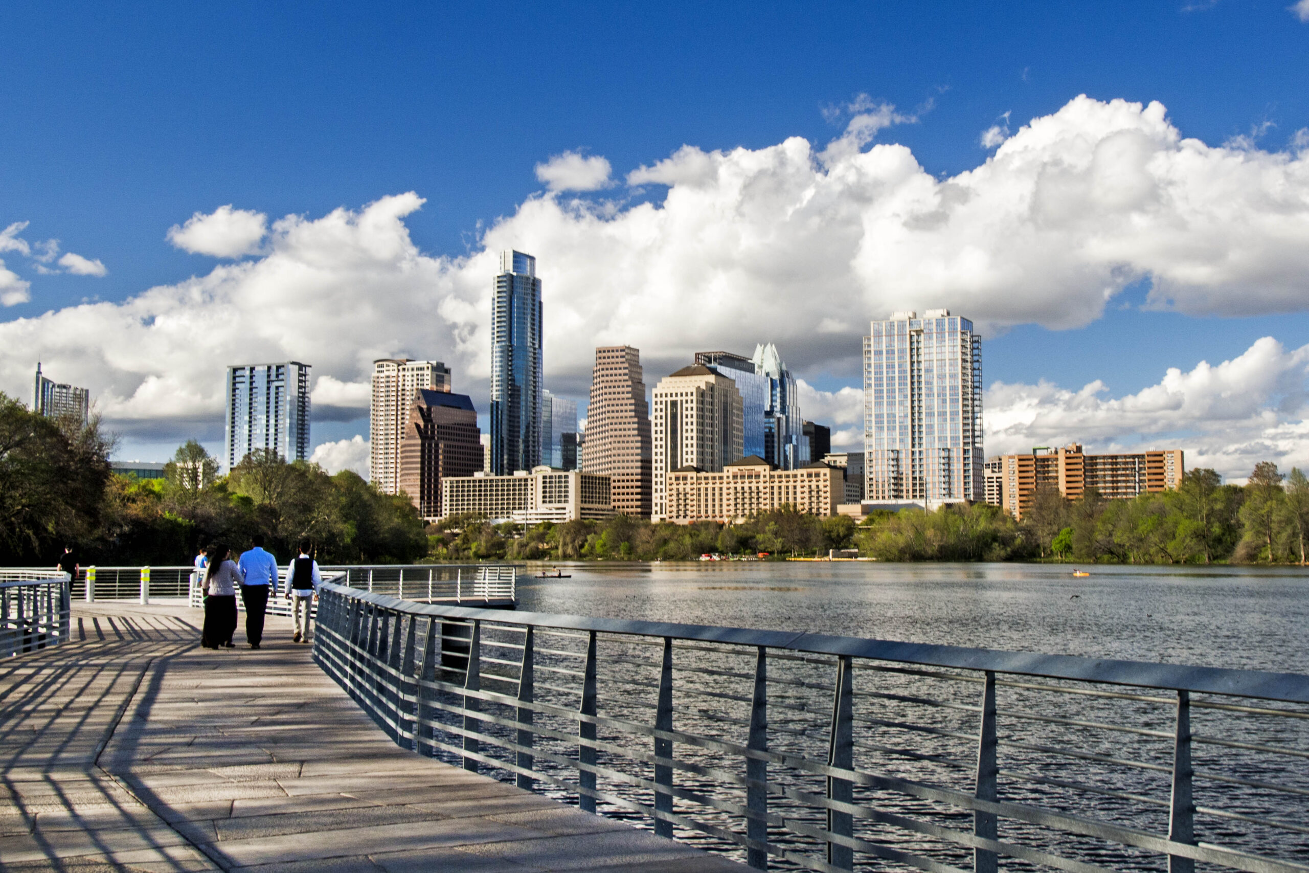 Austin city skyline overlooking a hike and bike trail by the lake