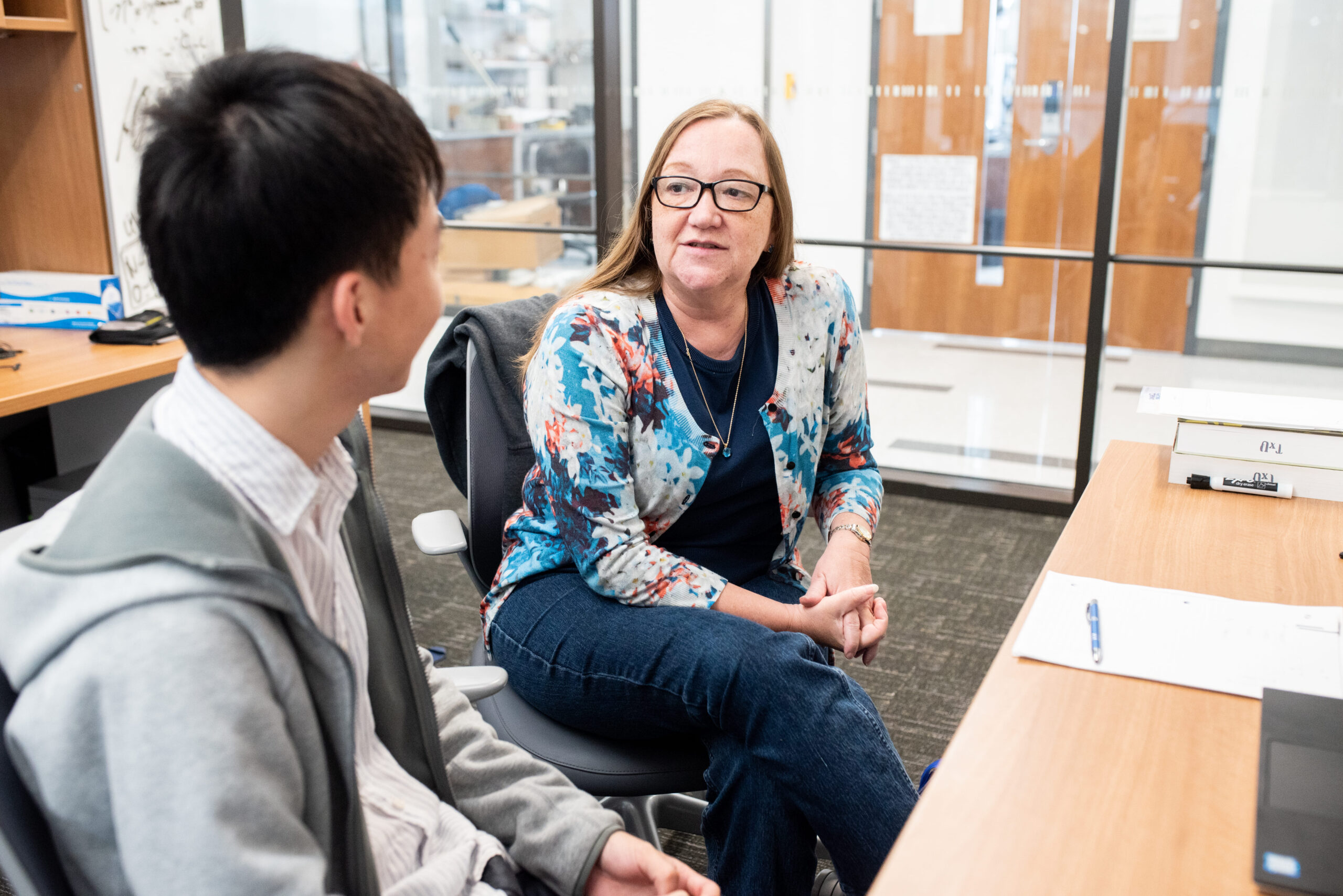 Texas Engineer Joan Brennecke talking with a student in a classroom