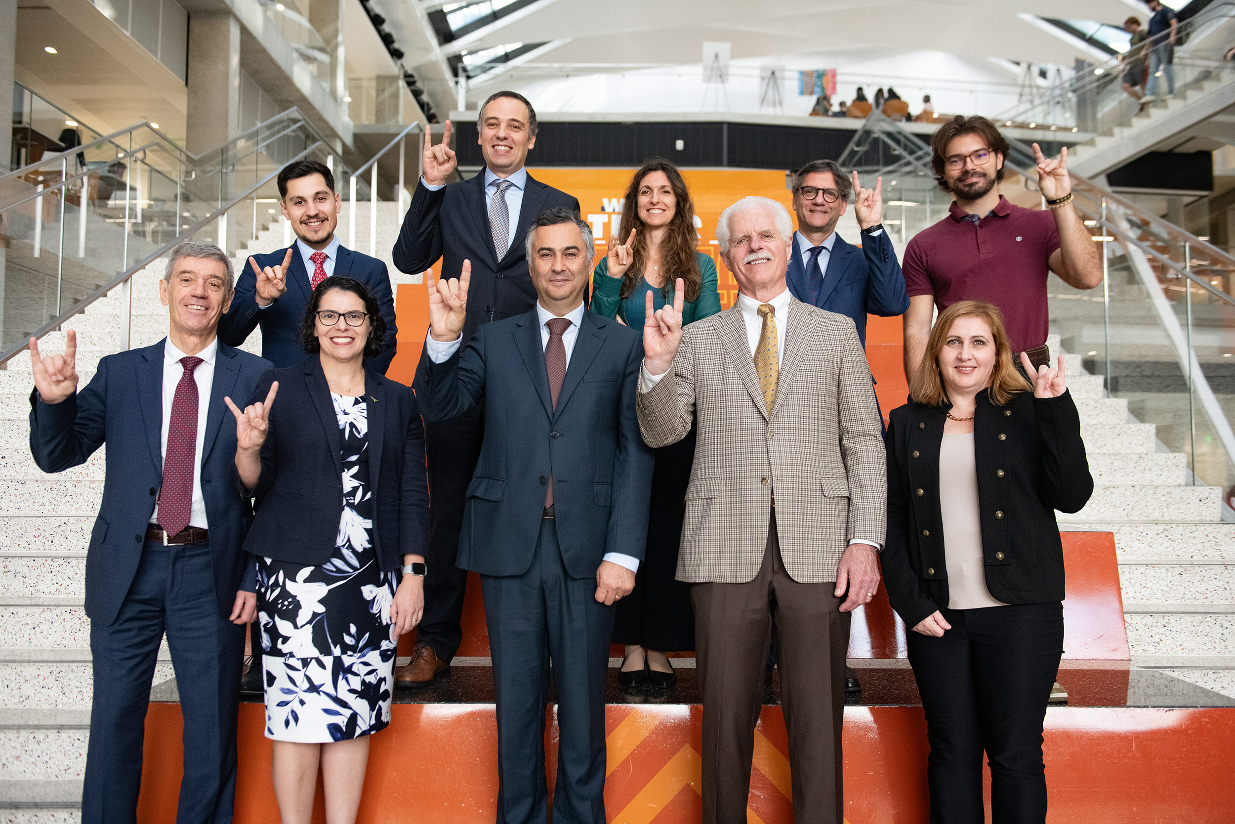 Texas Engineers and Portugal researchers and representatives smiling on EER staircase