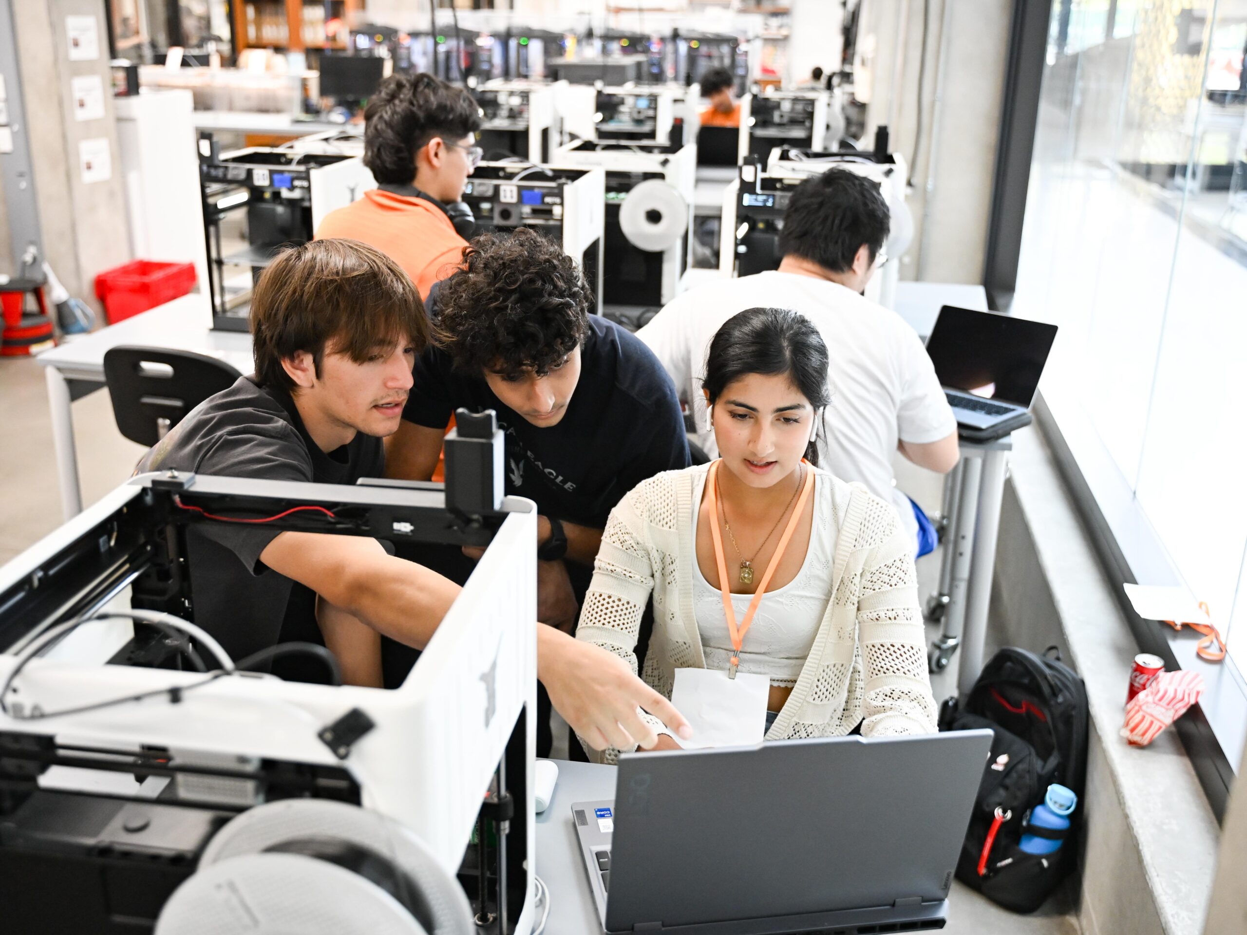 Students work together on a project at Texas Inventioworks.