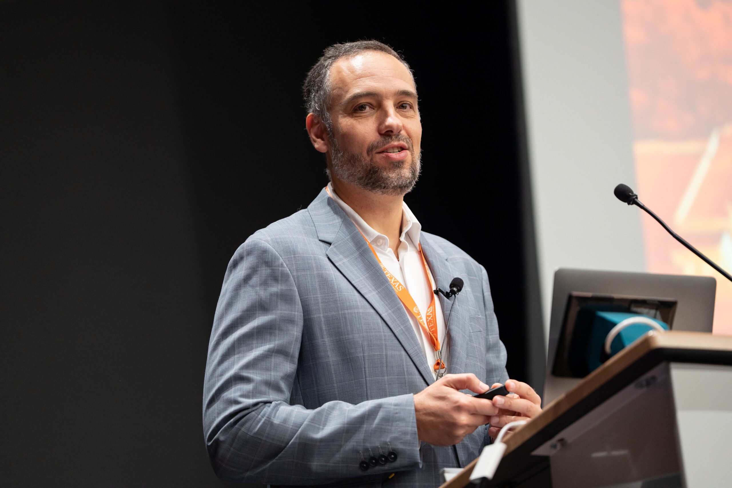 Marco Bravo speaking at podium