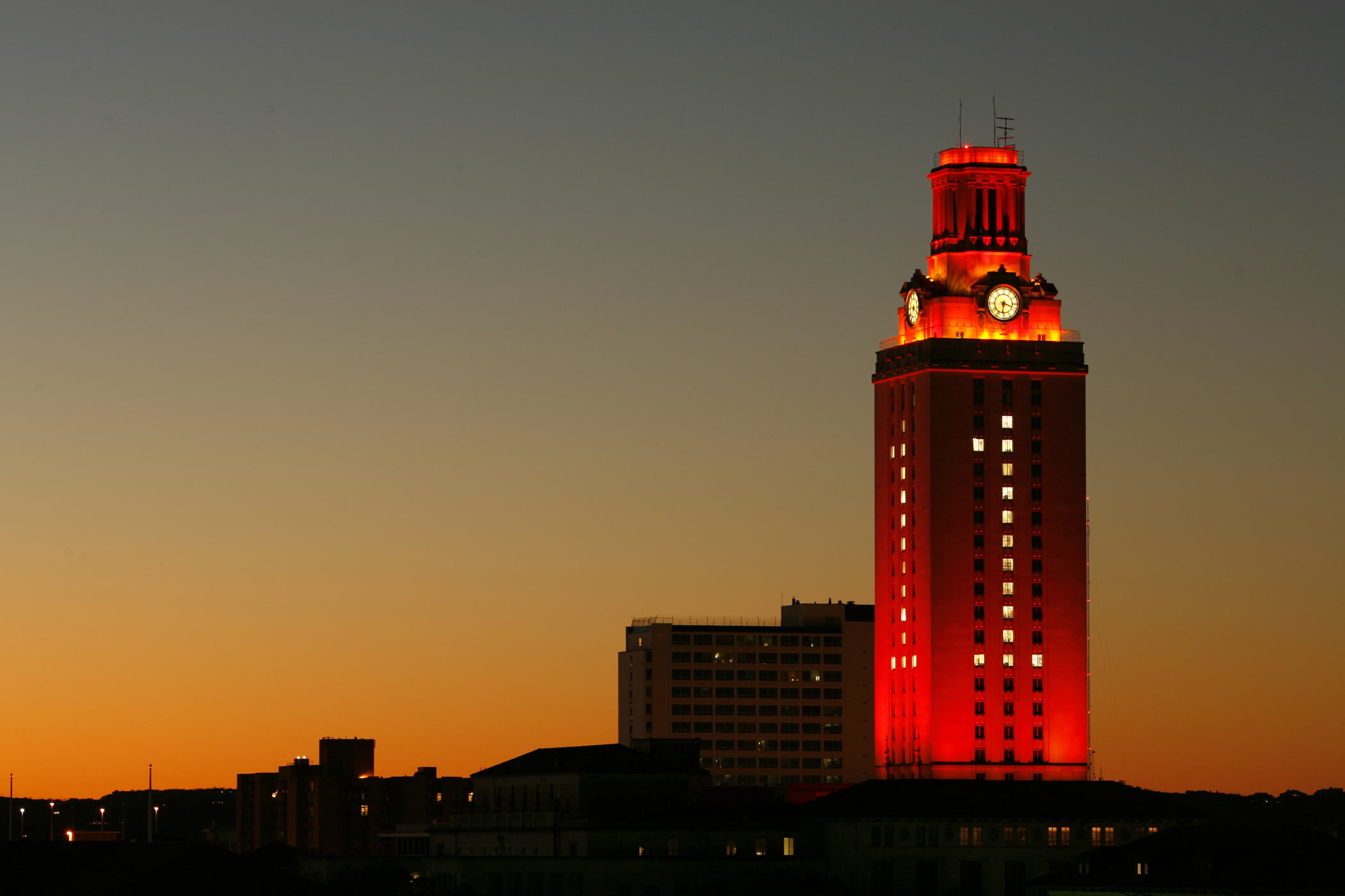 UT Austin tower at night with the number 1 lit in the windows