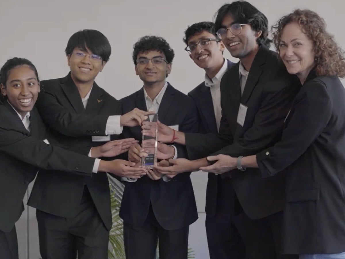 A group of UT students holding a trophy from the Stanford Center on Longevity’s Design Challenge.