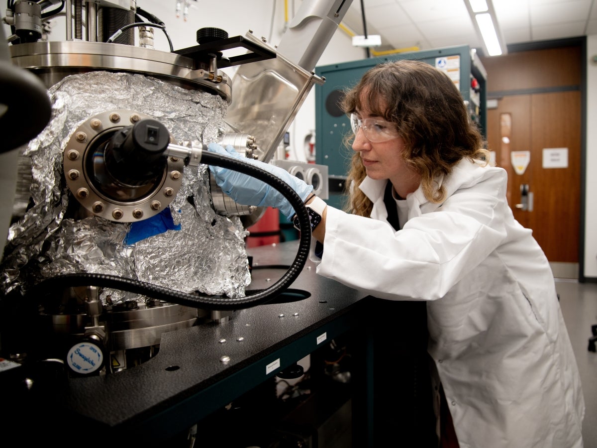 Professor Jean Anne Incorvia operates a semiconductor machine in her lab.