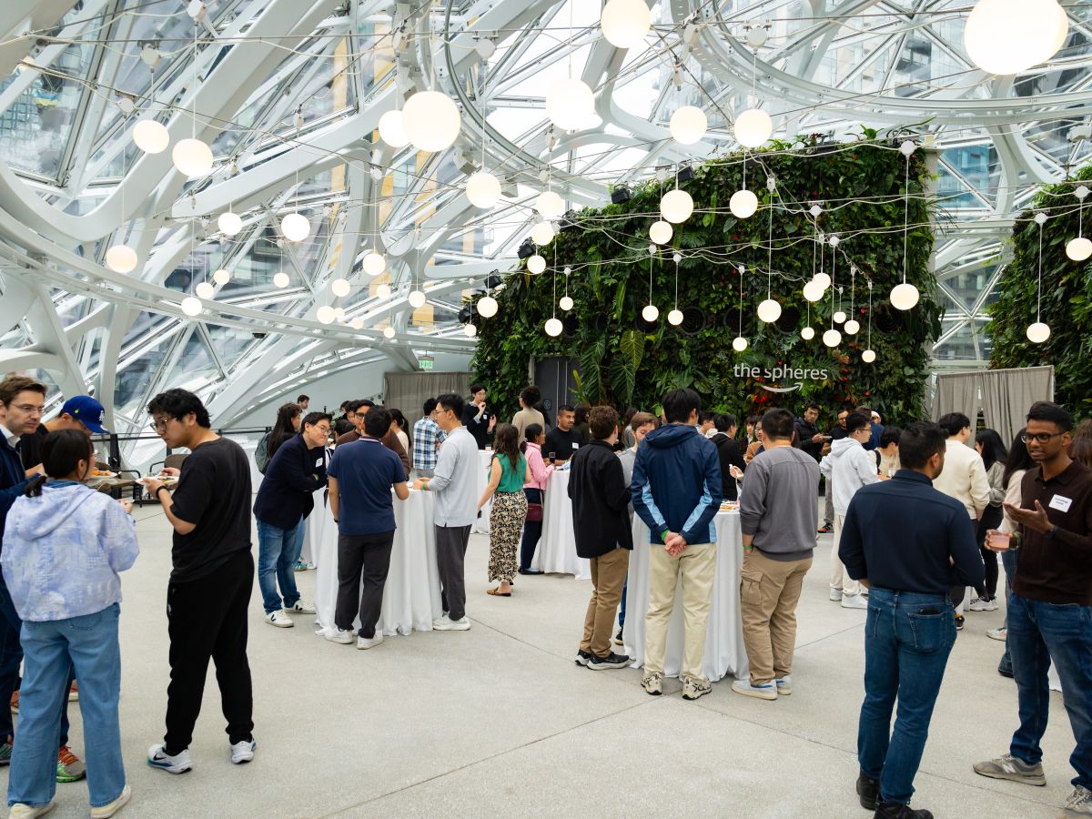 Students chat with Amazon employees at a reception at the Amazon campus in Seattle.