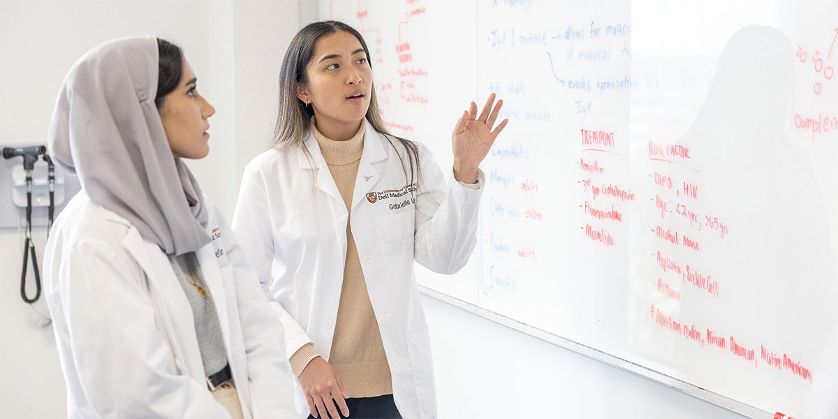 Dell Medical Students in front of white board