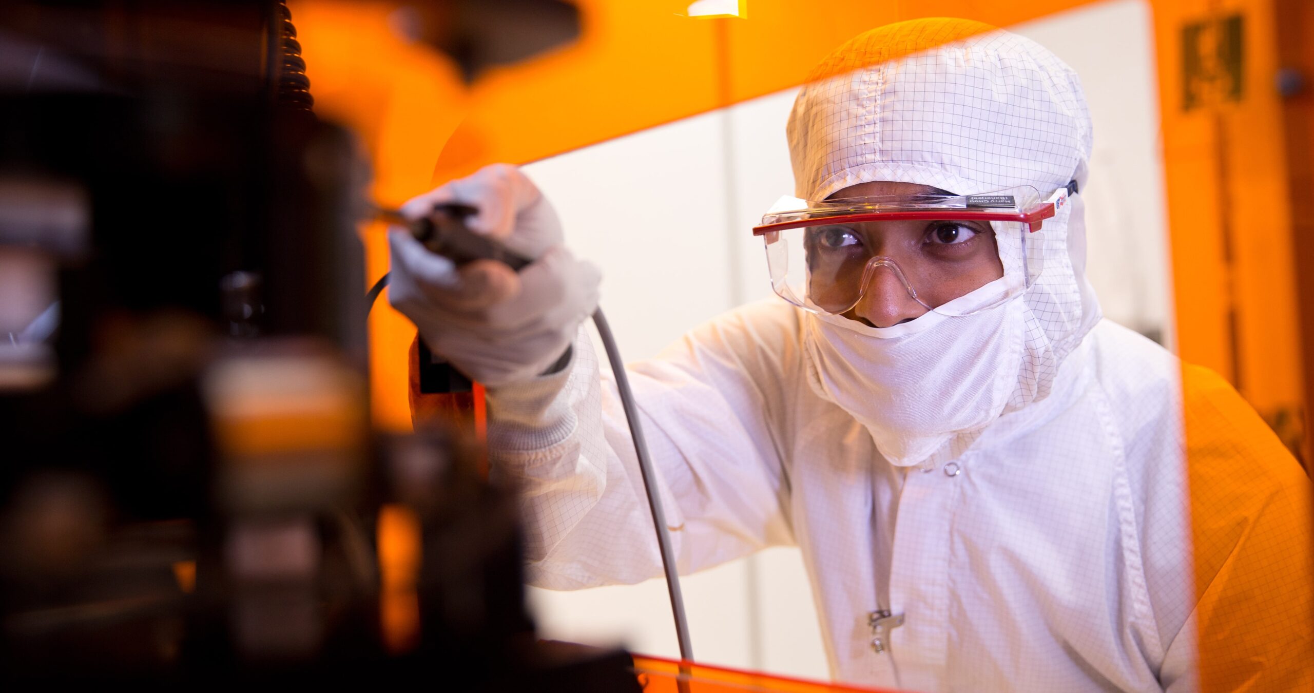 worker in semiconductor research lab
