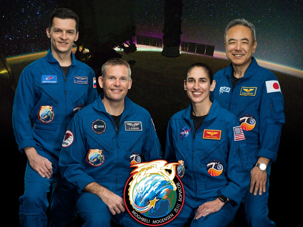 Texas Engineering alumnus Andreas Mogenson and his crew posing in NASA uniforms
