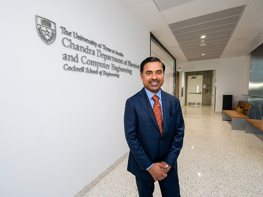 Sanjay Chandra stands in the hallway of the Cockrell School of Engineering