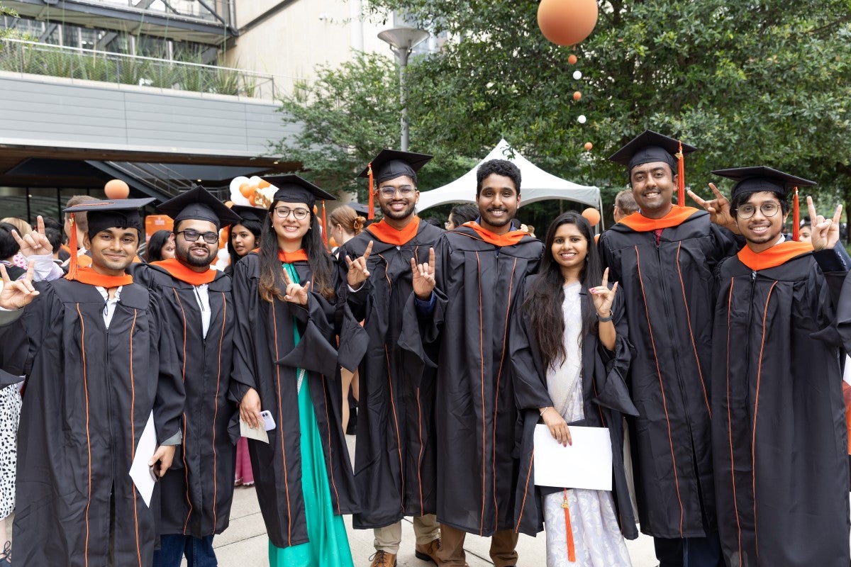 Texas Engineering students on graduation day wearing caps and gowns