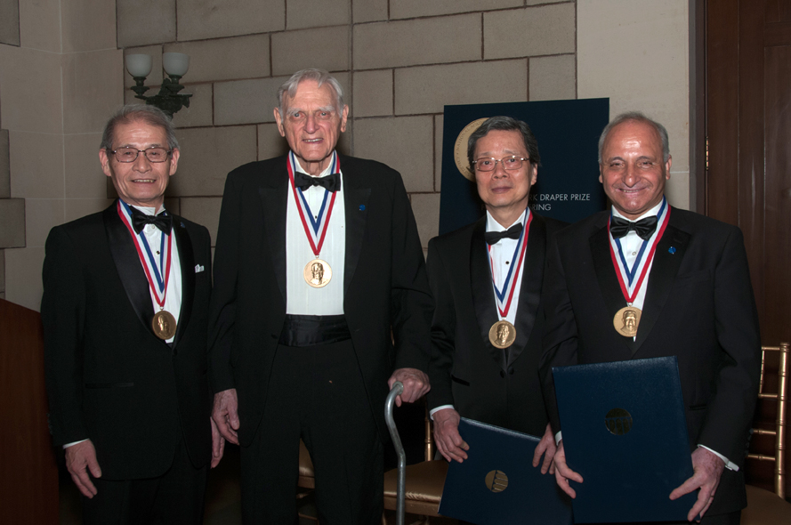 John B. Goodenough standing with fellow Draper Prize recipients